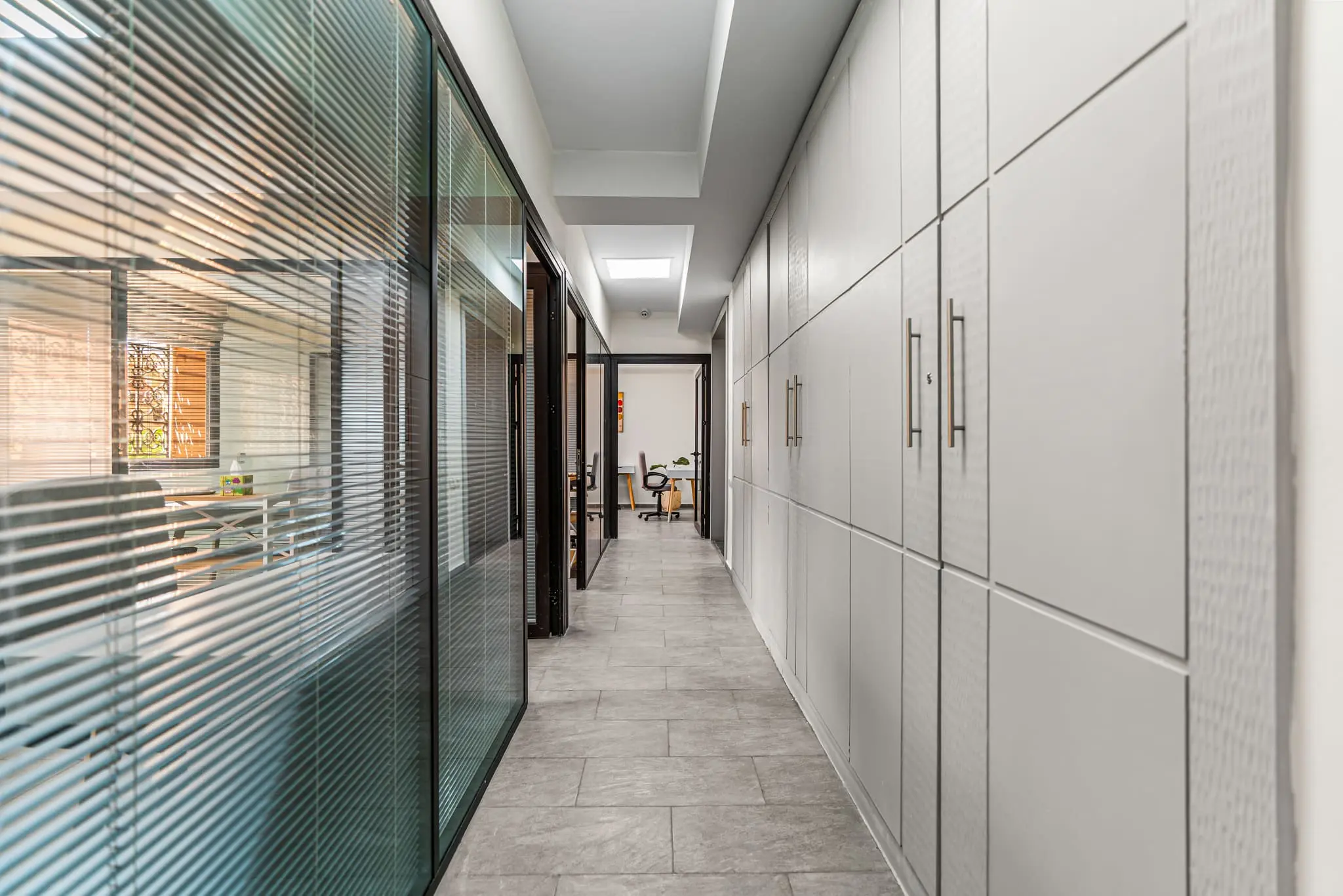 Corridor of glass-walled private offices in Marrakech